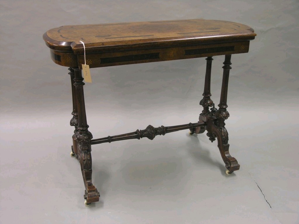 Appraisal: A Victorian inlaid burr walnut card table hinged top revolving