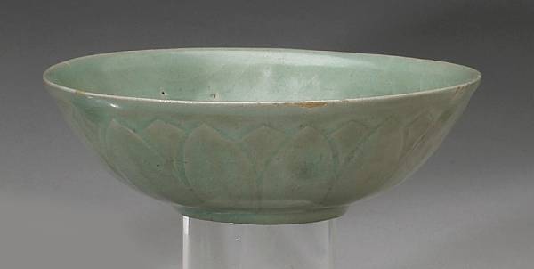 Appraisal: A celadon glazed shallow bowl Goryeo Dynasty Its exterior curving