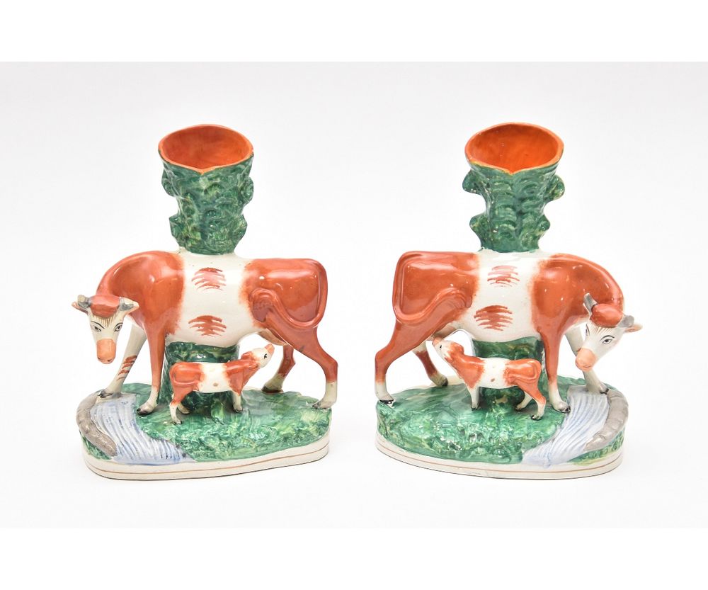 Appraisal: Pair of Staffordshire Spill Vases Large pair of Staffordshire cow