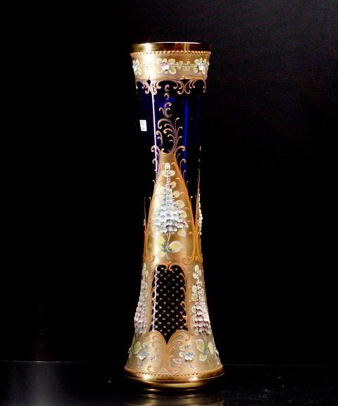 Appraisal: A Bohemian cobalt blue glass vase with applied gilt scrollwork