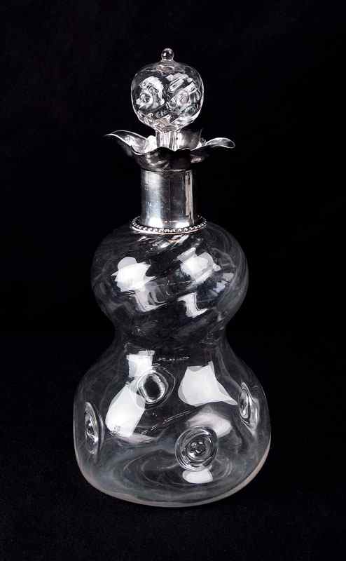 Appraisal: ENGLISH STERLING MOUNTED BLOWN GLASS DECANTER Bulbous form blown glass