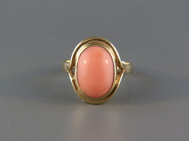 Appraisal: Coral Ring pink cabachon in k yellow gold signed currently