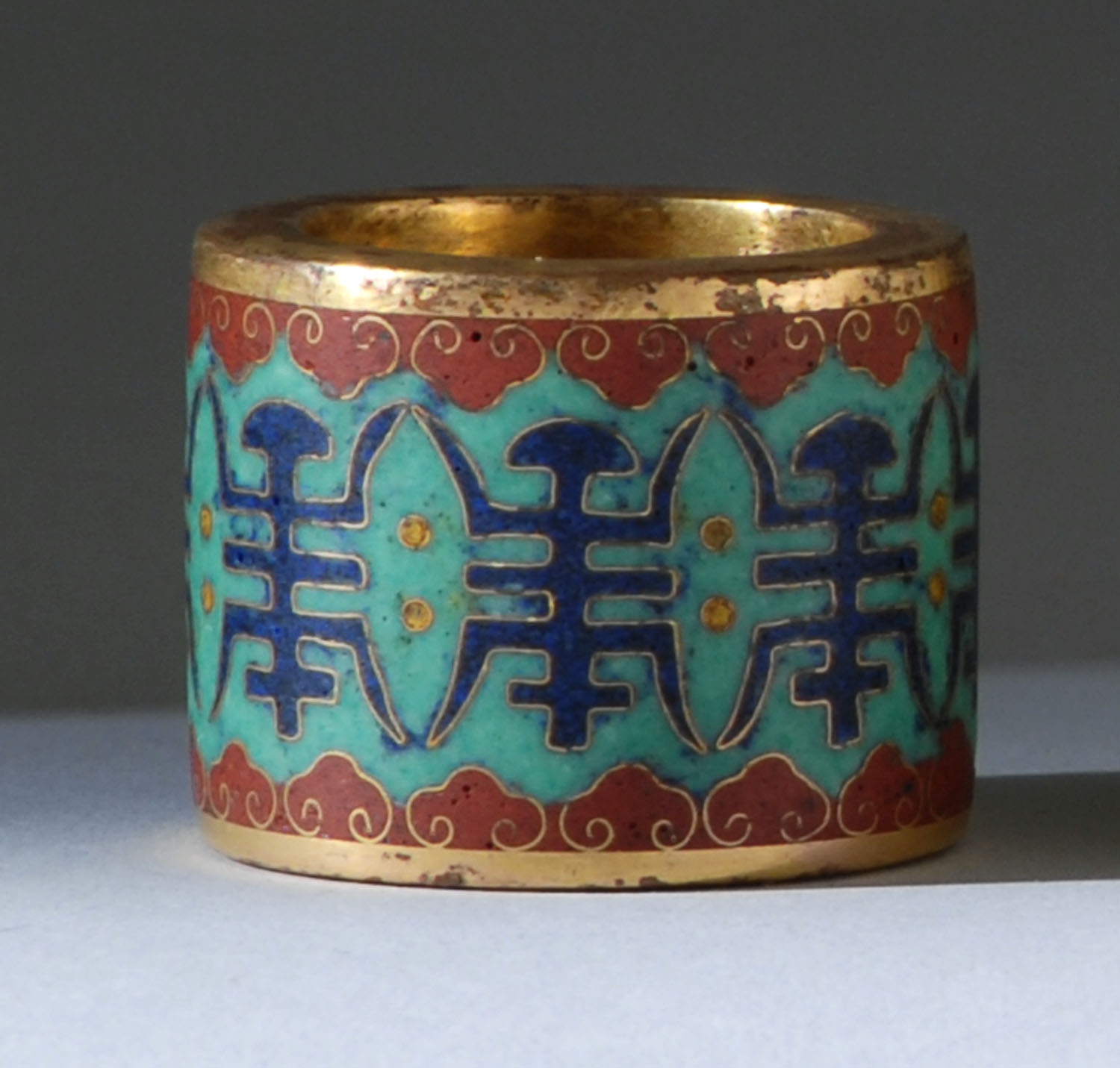 Appraisal: CLOISONN ENAMEL SCHOLAR'S RING th CenturyWith shou design in blue