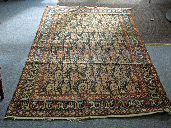 Appraisal: An Eastern rug the central blue ground field decorated numerous