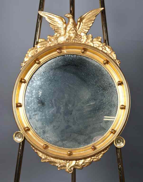 Appraisal: A Fine Federal Style Bullseye Gilded MirrorCarved wood mirror with