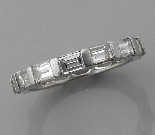 Appraisal: A diamond and platinum eternity band estimated total diamond weight