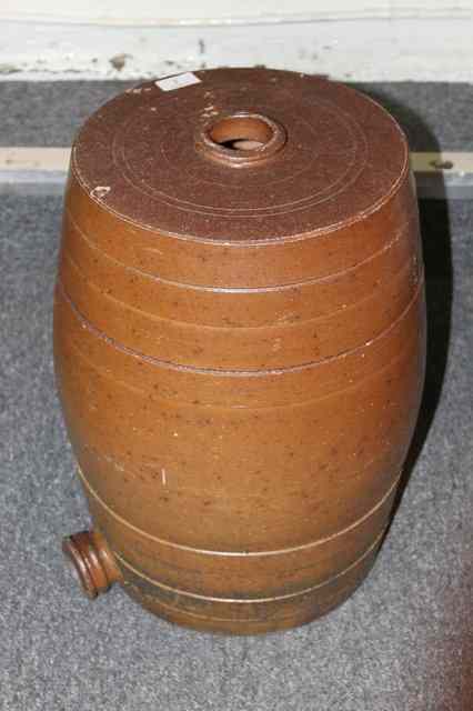 Appraisal: A CERAMIC BARREL of usual form with salt glazed finish