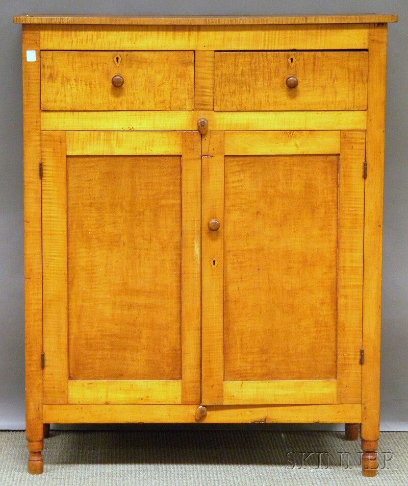 Appraisal: Tiger Maple Cupboard with Two Paneled Doors turned feet the