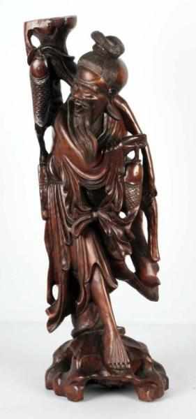 Appraisal: Teak Wood Carved Man with Fish Condition Excellent Size T