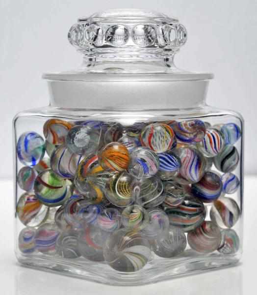 Appraisal: Jar of Handmade Marbles Description All swirls except for four