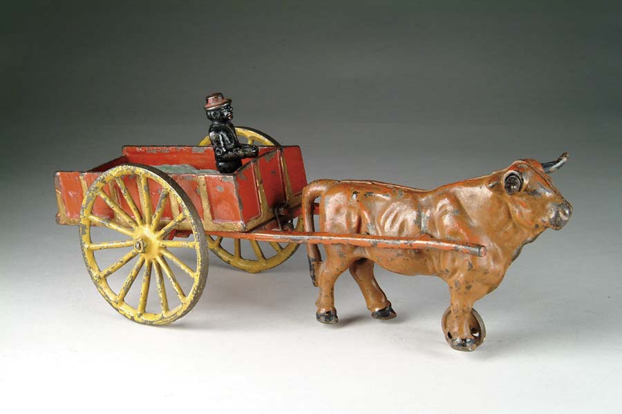 Appraisal: HUBLEY OXEN PLANTATION CART This toy features a standing black