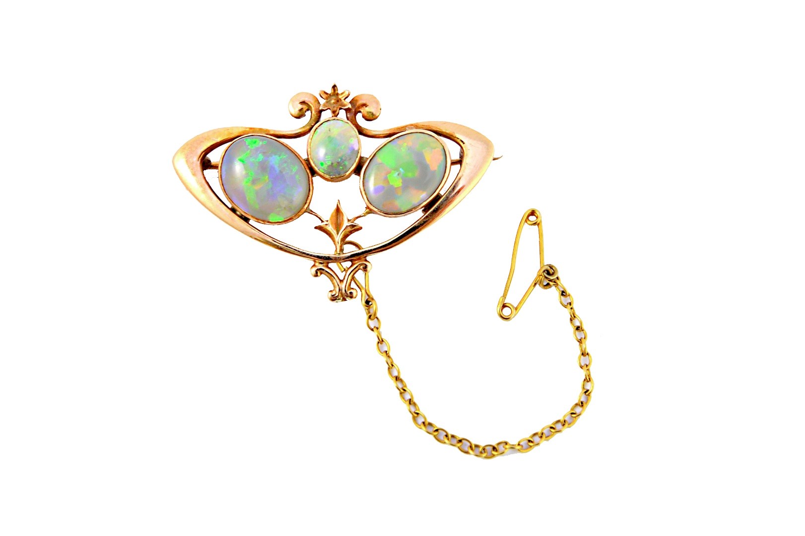 Appraisal: A gold brooch mounted with three oval opals pierced in