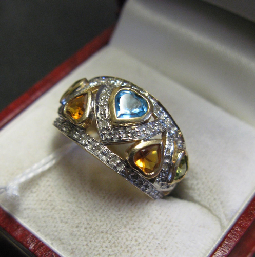 Appraisal: PERIDOT CITRINE BLUE TOPAZ DIAMOND AND TEN KARAT GOLD RING