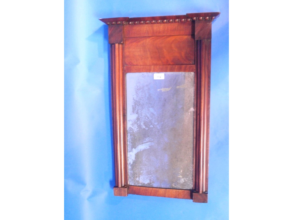 Appraisal: A Regency flamed mahogany pier glass with cluster columns cm