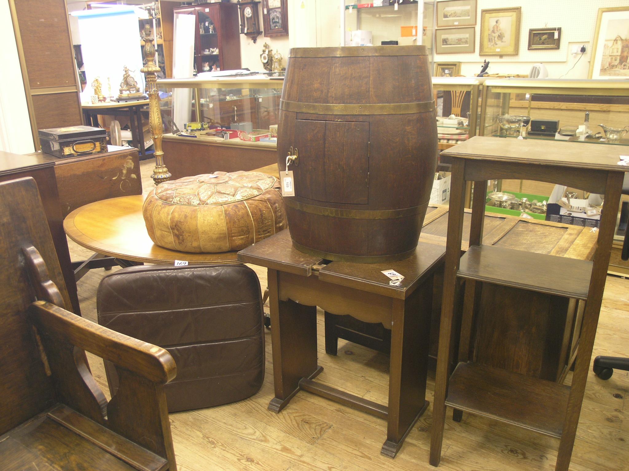 Appraisal: An oak and brass-bound barrel converted to drinks cabinet ft