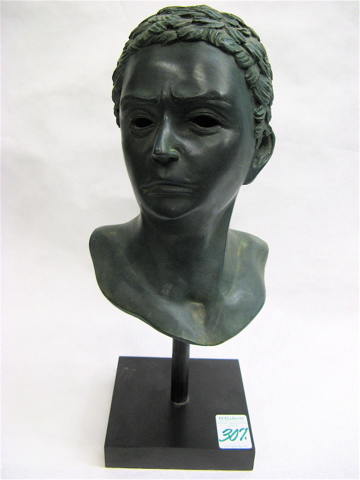 Appraisal: BRONZE BUST OF A CLASSICAL FIGURE the Cicero-like green patinated