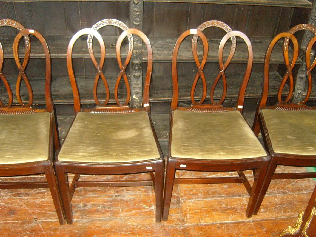 Appraisal: A set of Georgian style walnut dining chairs with hooped