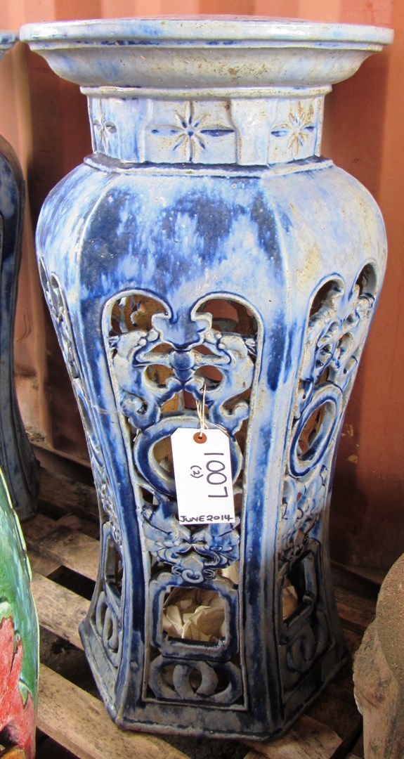 Appraisal: A pair of blue glazed terracotta urn stands on pierced