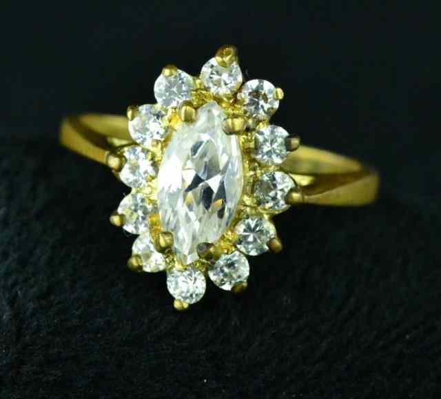 Appraisal: LADY'S COCKTAIL RING karat gold band with marquis-set stone Private