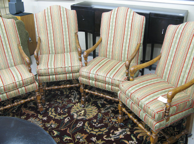 Appraisal: A SET OF FOUR GEORGIAN INSPIRED CLUB CHAIRS ON CASTERS