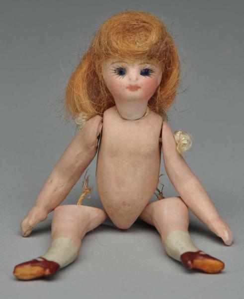 Appraisal: Dainty French Bisque Mignonnette Description All-bisque doll with swivel neck