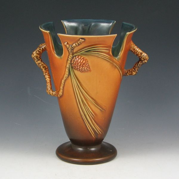 Appraisal: Roseville Pine Cone vase in brown with notched or cut-out