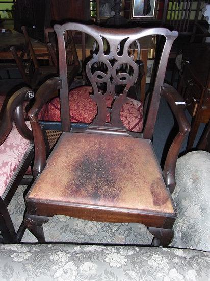 Appraisal: A GEORGE III MAHOGANY SPLAT BACK ELBOW CHAIR on cabriole