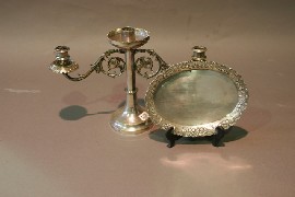 Appraisal: A silver-plated candlestick and tray