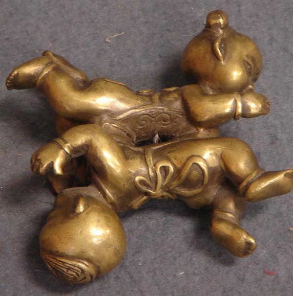 Appraisal: Brass or child illusionary figurine x Estimate -