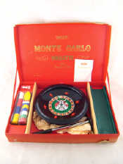 Appraisal: A Merit Monte Carlo roulette wheel complete with chips and