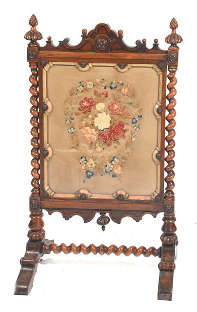 Appraisal: A VICTORIAN ROSEWOOD FIRE SCREEN with needlework panel and twisted