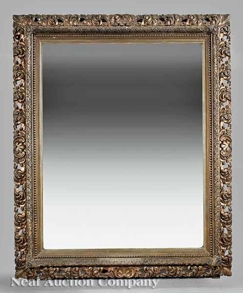 Appraisal: A Large Beaux Arts Carved and Gilded Mirror late th