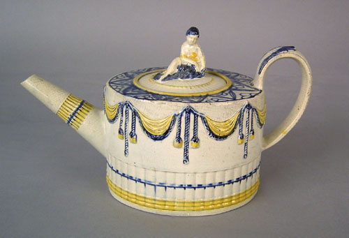 Appraisal: Prattware teapot ca with relief swag decoration and figural finial