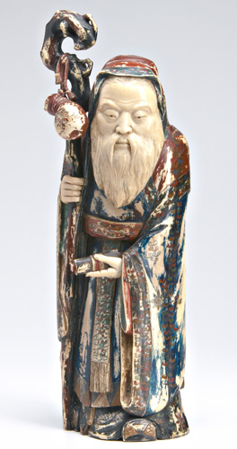 Appraisal: JAPANESE IVORY Stained and painted carved okimono of a bearded