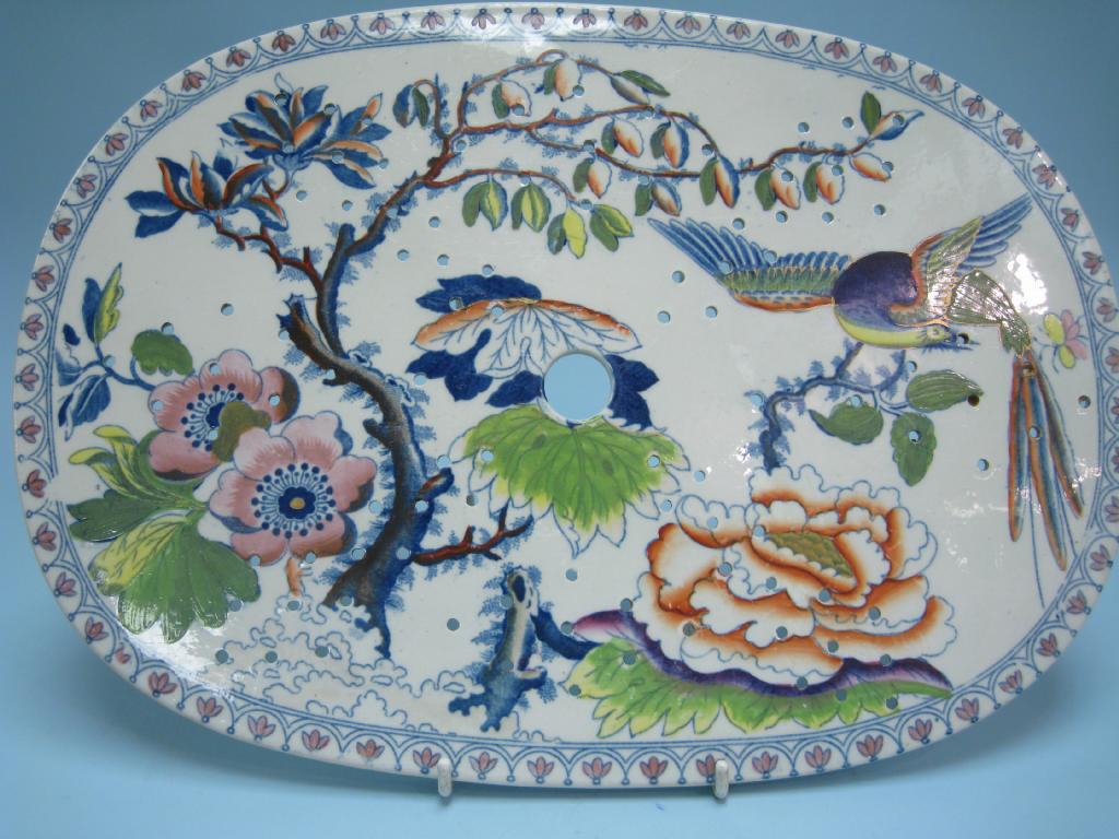 Appraisal: A th Century Strainer Dish transfer decorated bird of paradise