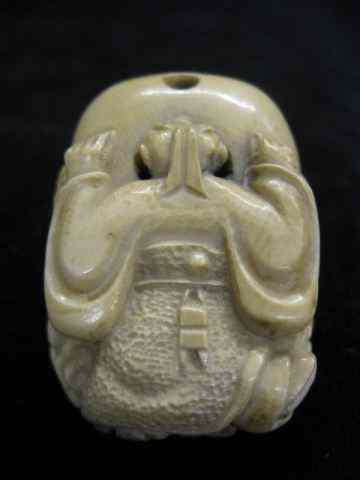 Appraisal: Carved Ivory Erotic Netsuke closed box style depicts man looking