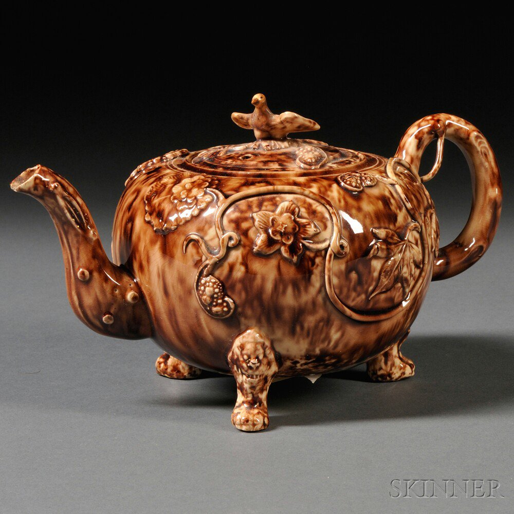 Appraisal: Staffordshire Cream-colored Earthenware Teapot and Cover England c bulbous shape