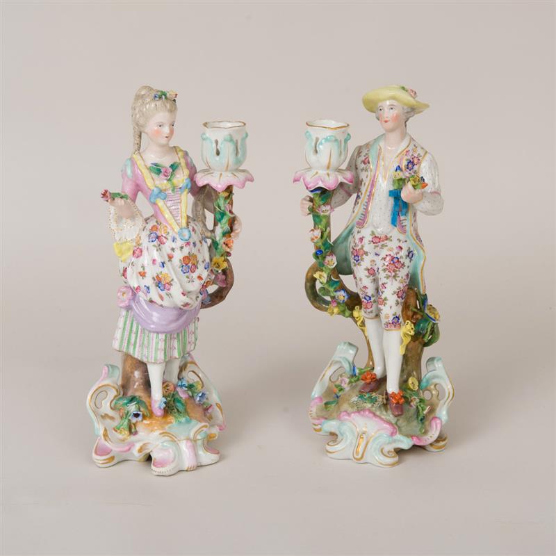 Appraisal: PAIR OF CHELSEA DERBY STYLE PORCELAIN FIGURAL CANDLESTICKS Marked in