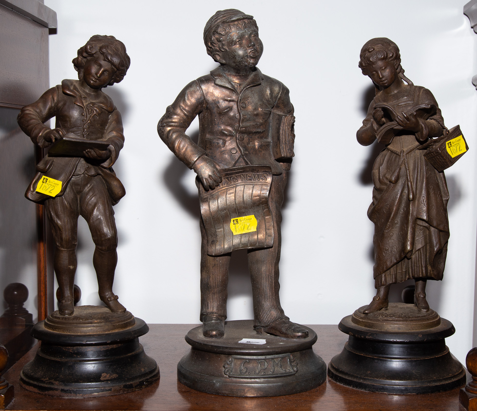 Appraisal: THREE PATINATED METAL FIGURES OF CHILDREN Early th century to