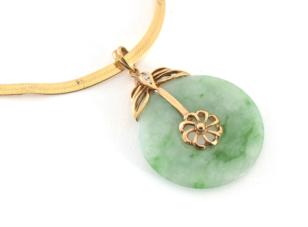 Appraisal: K JADEITE JADE PENDANT AND CHAIN K yellow gold pendant