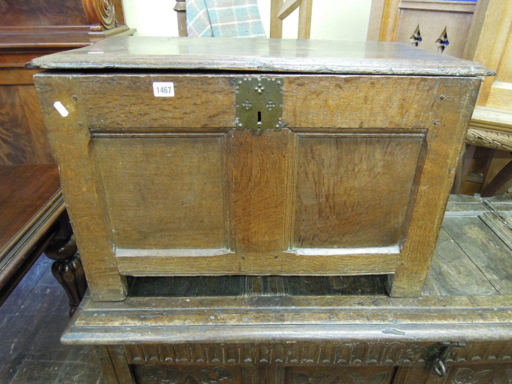 Appraisal: A small Georgian oak coffer with panelled frame with chamfered