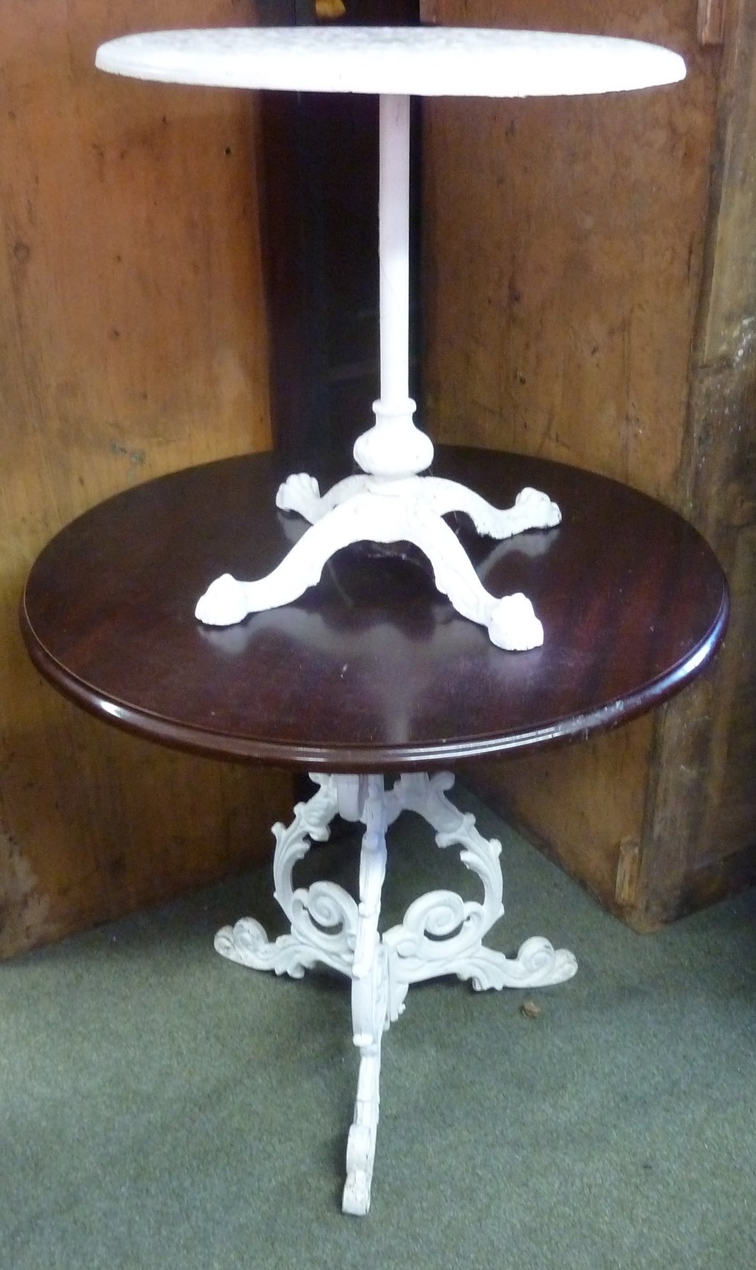 Appraisal: A circular mahogany table with cast iron support cm diameter