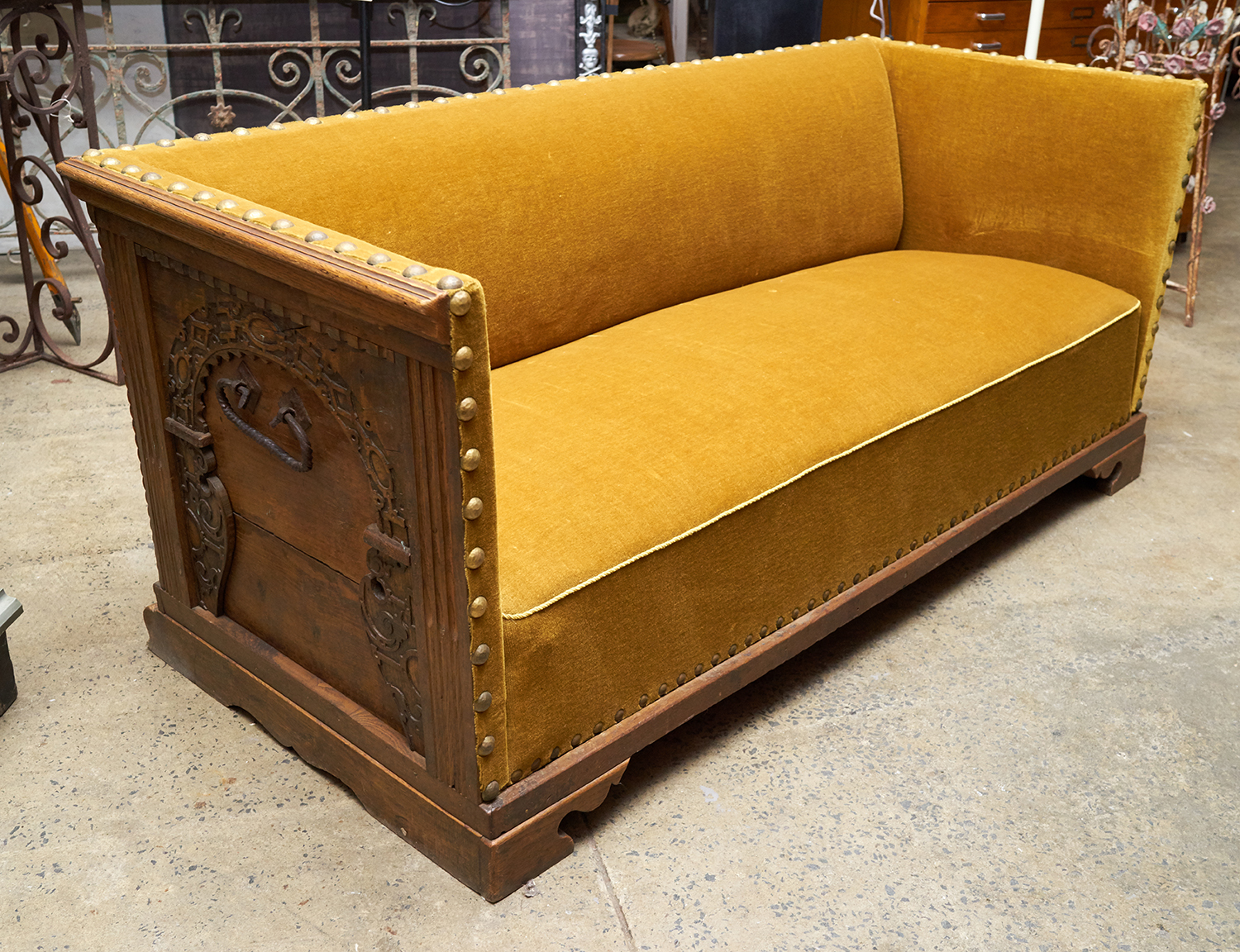 Appraisal: AN IMPRESSIVE SPANISH STYLE SOFA WITH ORNATE CARVED BACK Mustard