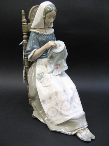 Appraisal: LLADRO GLAZED PORCELAIN FIGURE of a seated young lady embroidering