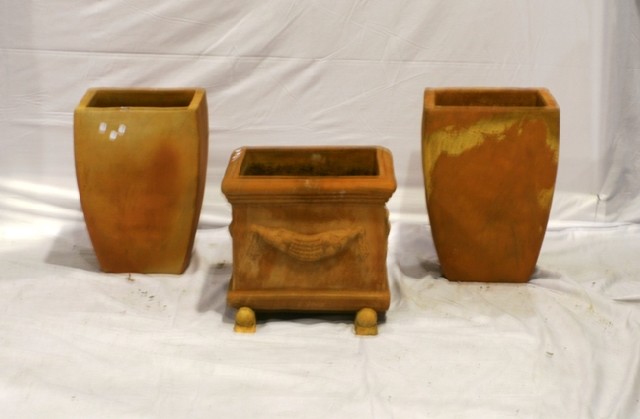 Appraisal: A pair of square-section tapering terracotta pots together with another