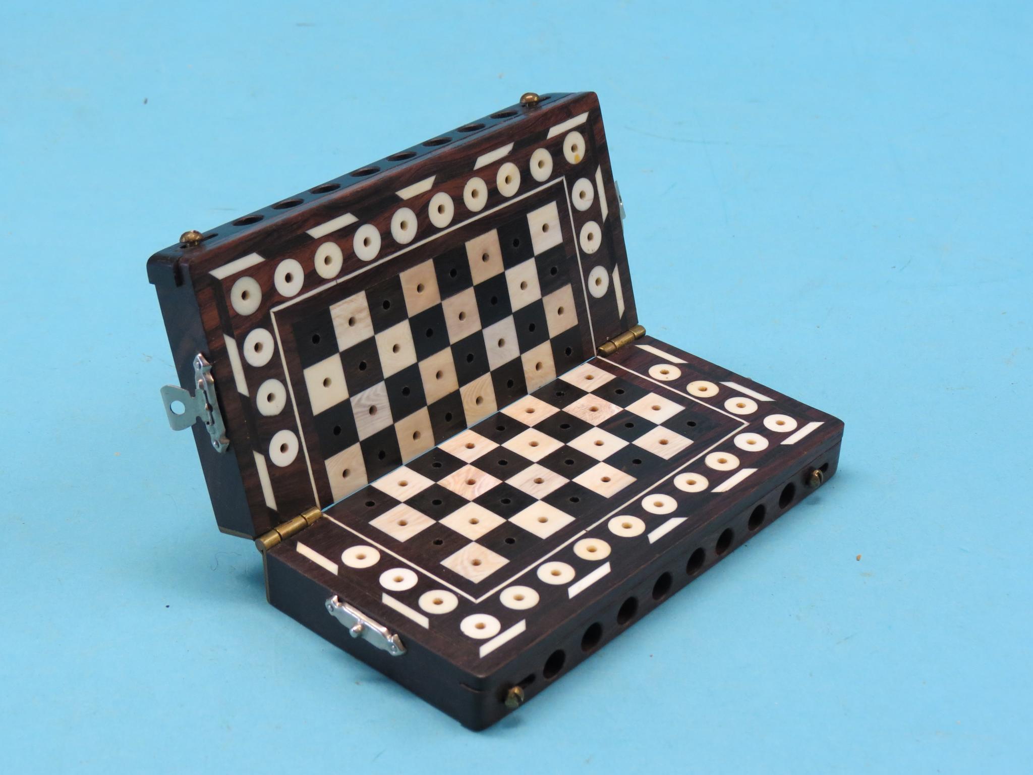 Appraisal: An ebony and bone travelling chess set folding action complete