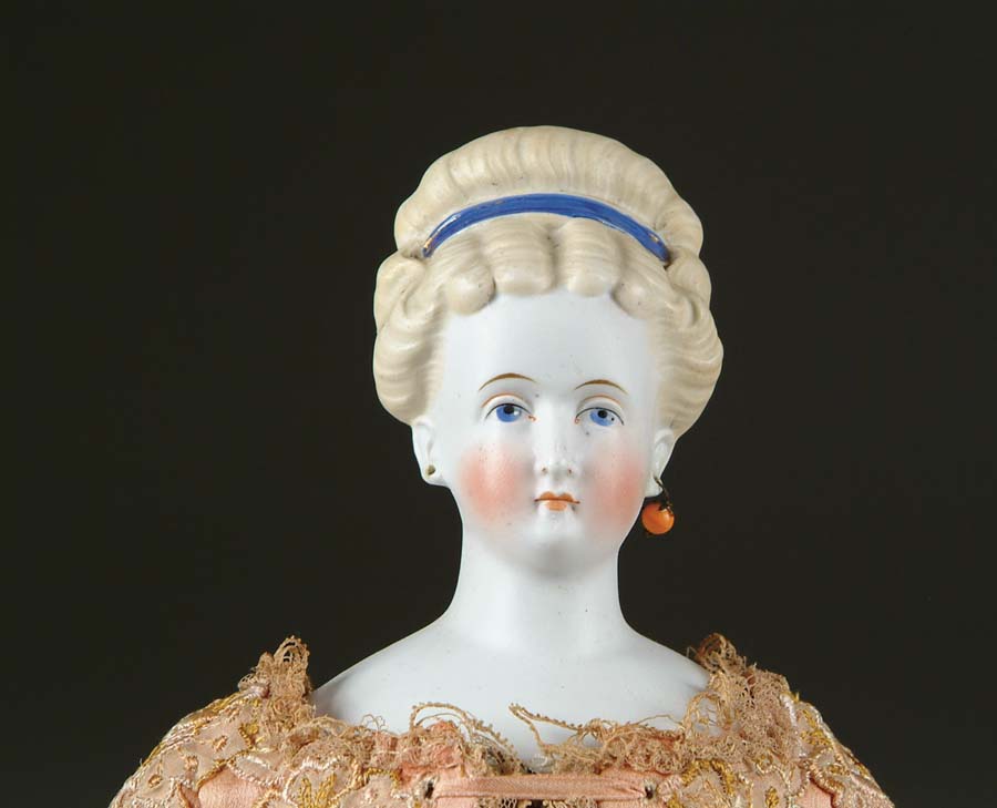 Appraisal: PARIAN DOLL Doll has upswept blonde molded hair held by