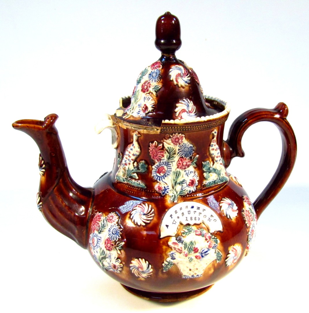 Appraisal: Late thC bargeware teapot a present to W Sutton of