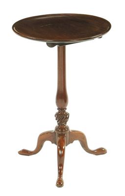 Appraisal: A mahogany tripod table the circular moulded edge top on