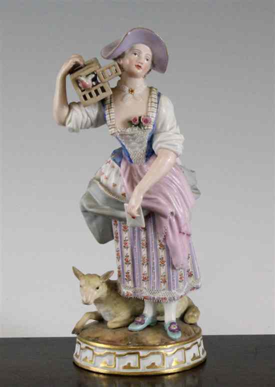 Appraisal: A Meissen figure of a lady holding a birdcage late